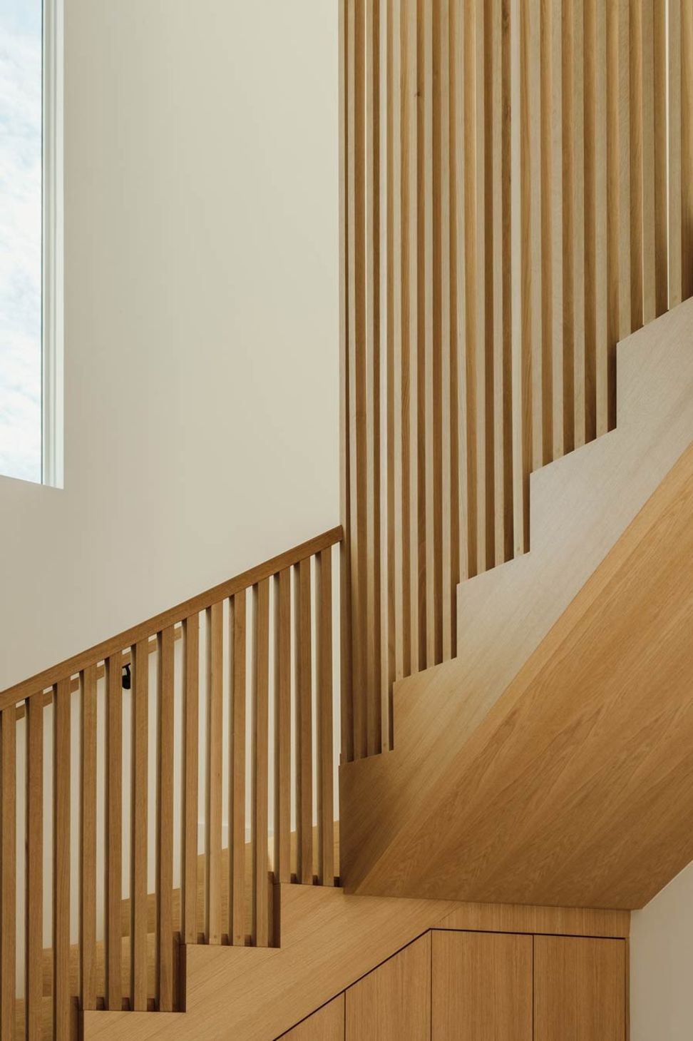 imgi16custom-light-wood-stair-in-organic-modern-home-with-builtin-millwork.jpg