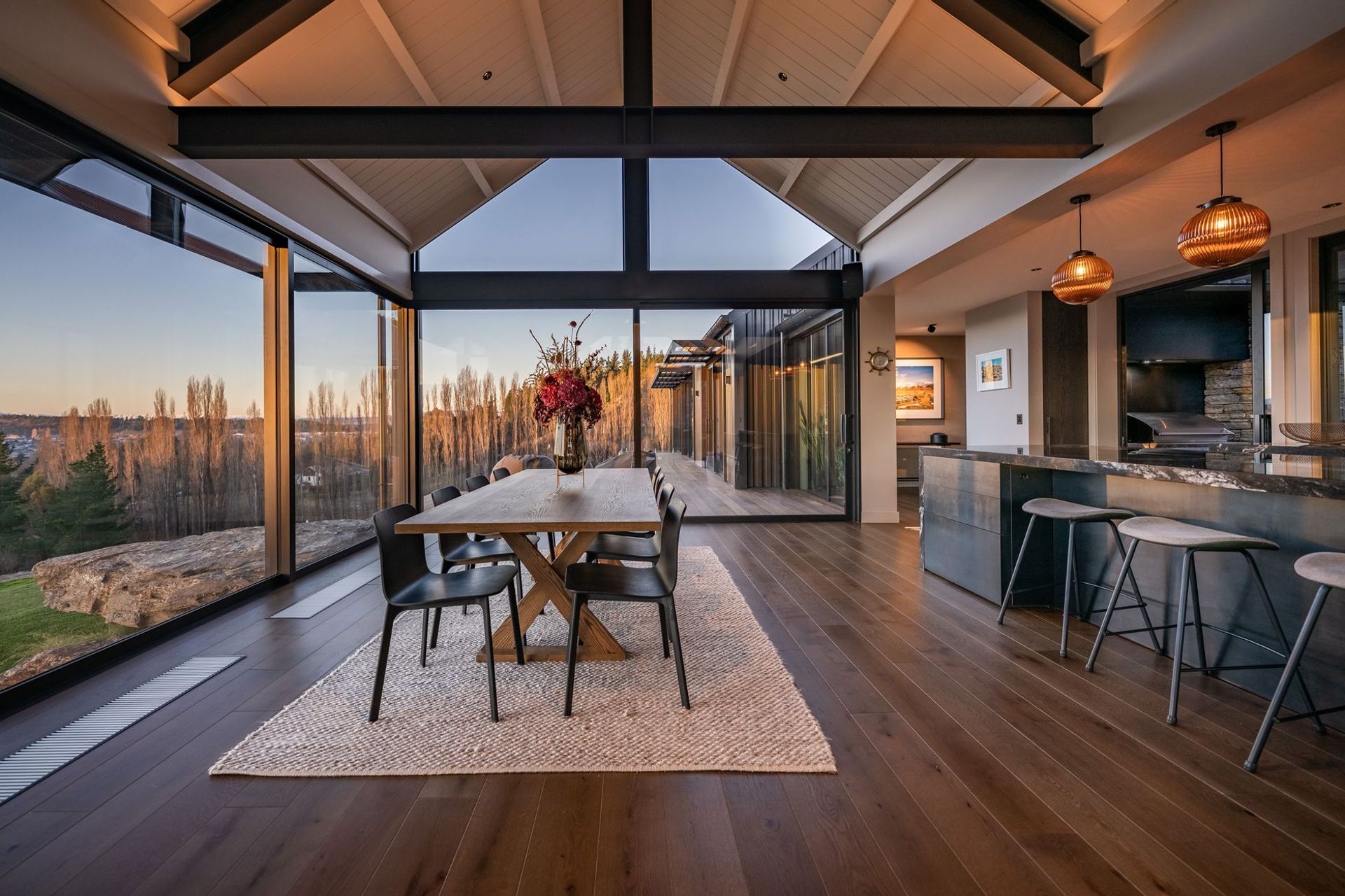 The open-plan kitchen dining enjoys panoramic views of the valley below.