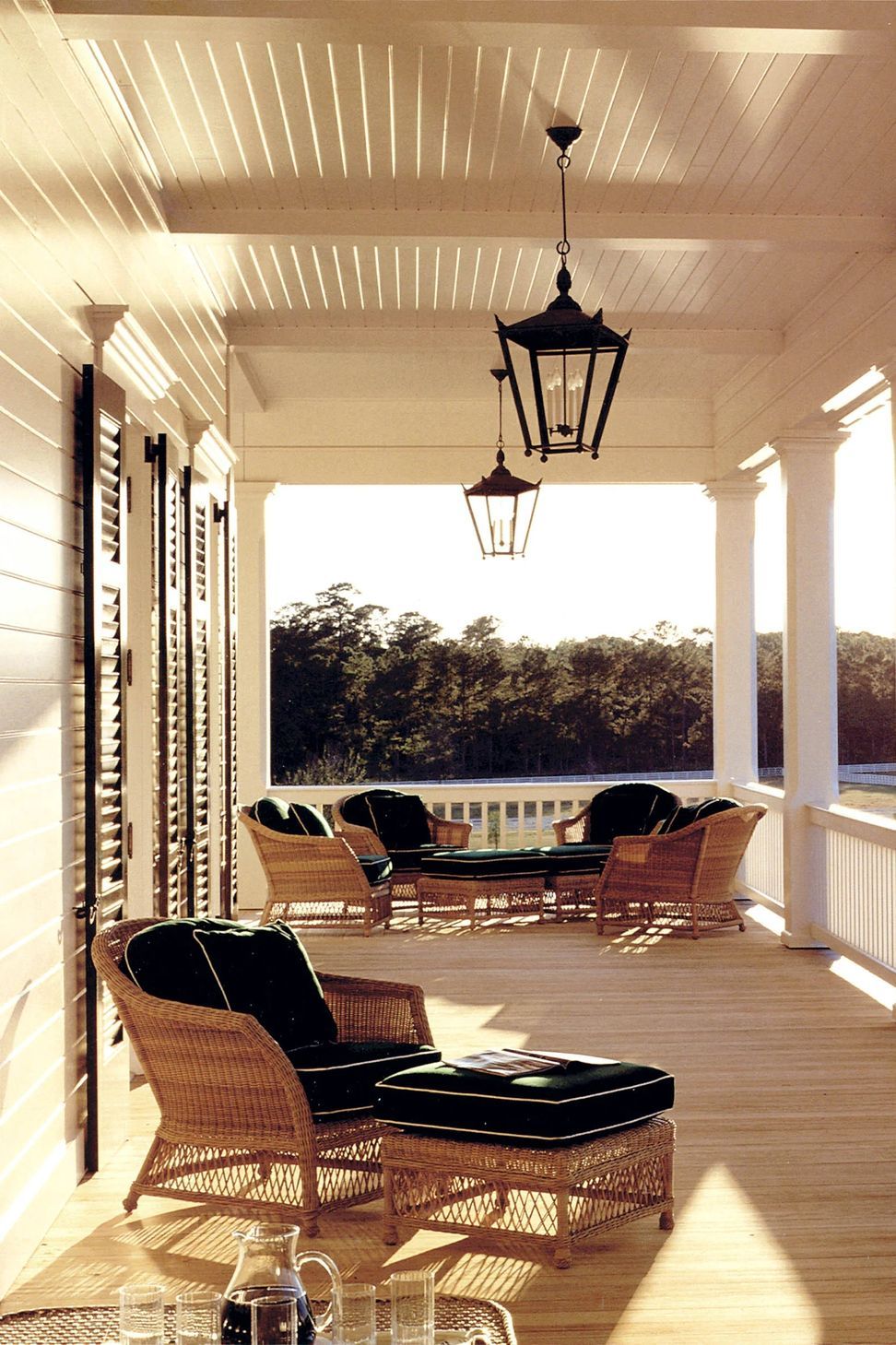 georgian-lowcountry-manor-veranda-double-colonnade-porch-architectural-details-shutters-ap-compressed.jpg