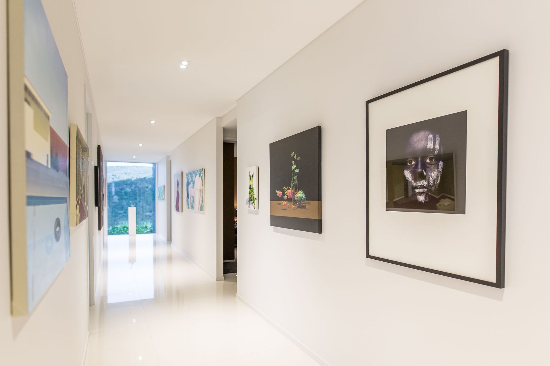 Directly off the entrance is a large gallery space, which serves as the dividing element between the private and public spaces.