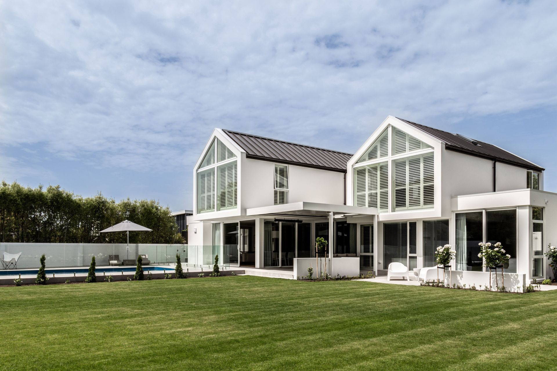 The back end of the gables are glazed, to let light in through the north-facing backyard.