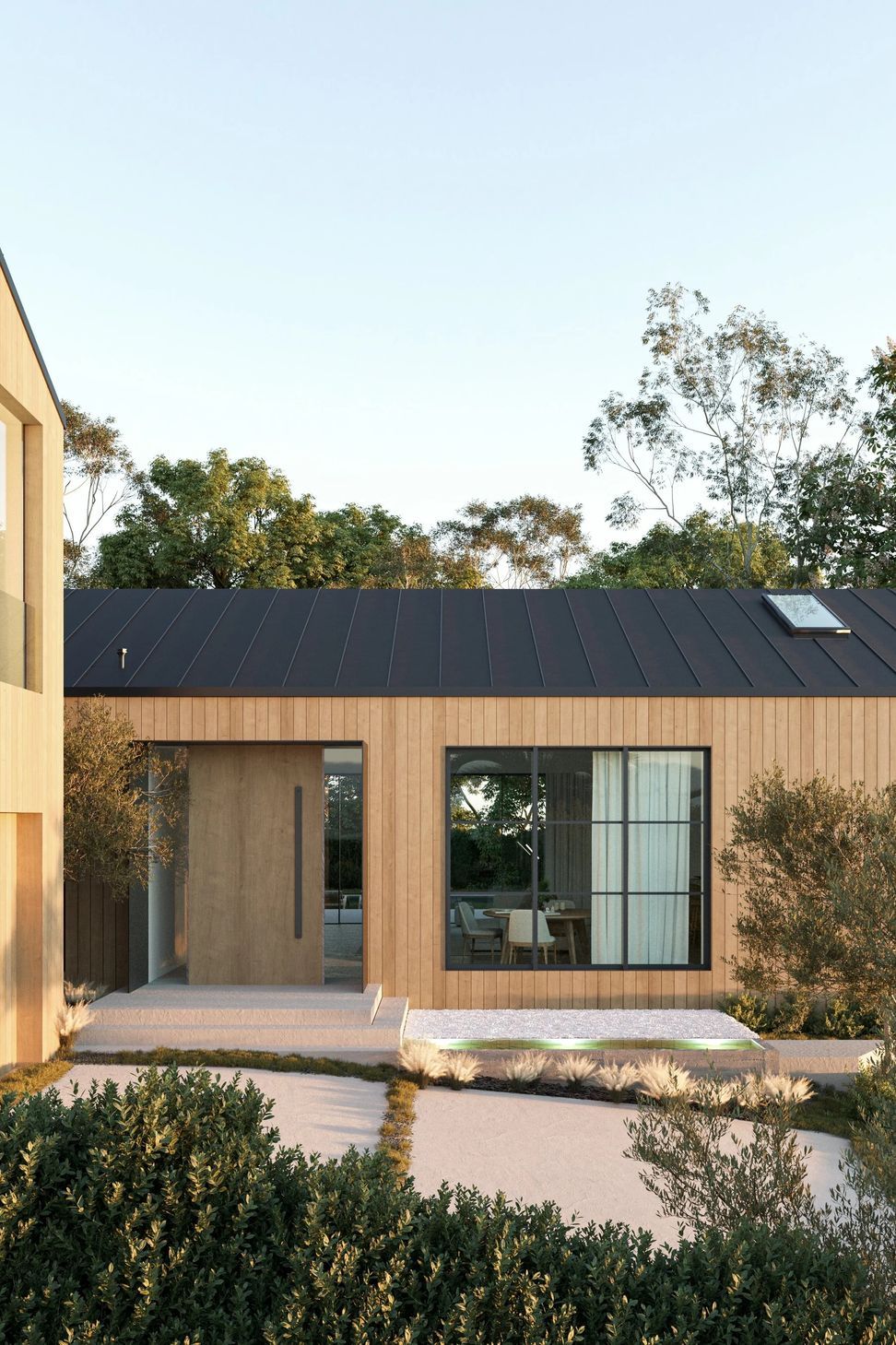 Exterior wood cladding, large windows, and gable standing-seam metal roofs reference homes found in California Wine Country.