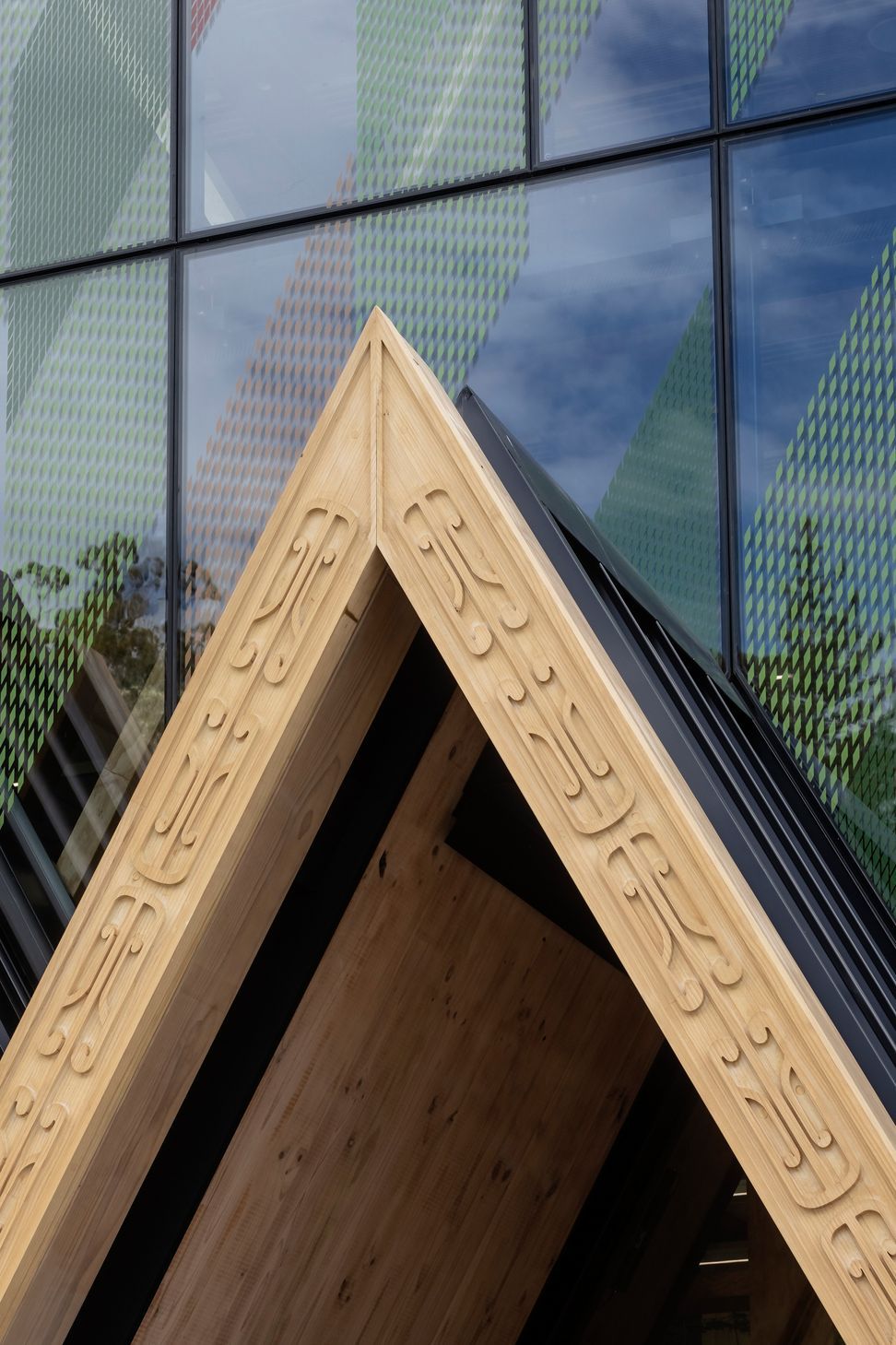 Machine-routed carving, designed by local carver Grant Marunui, adorns the 'triple peak' entrance to the centre.