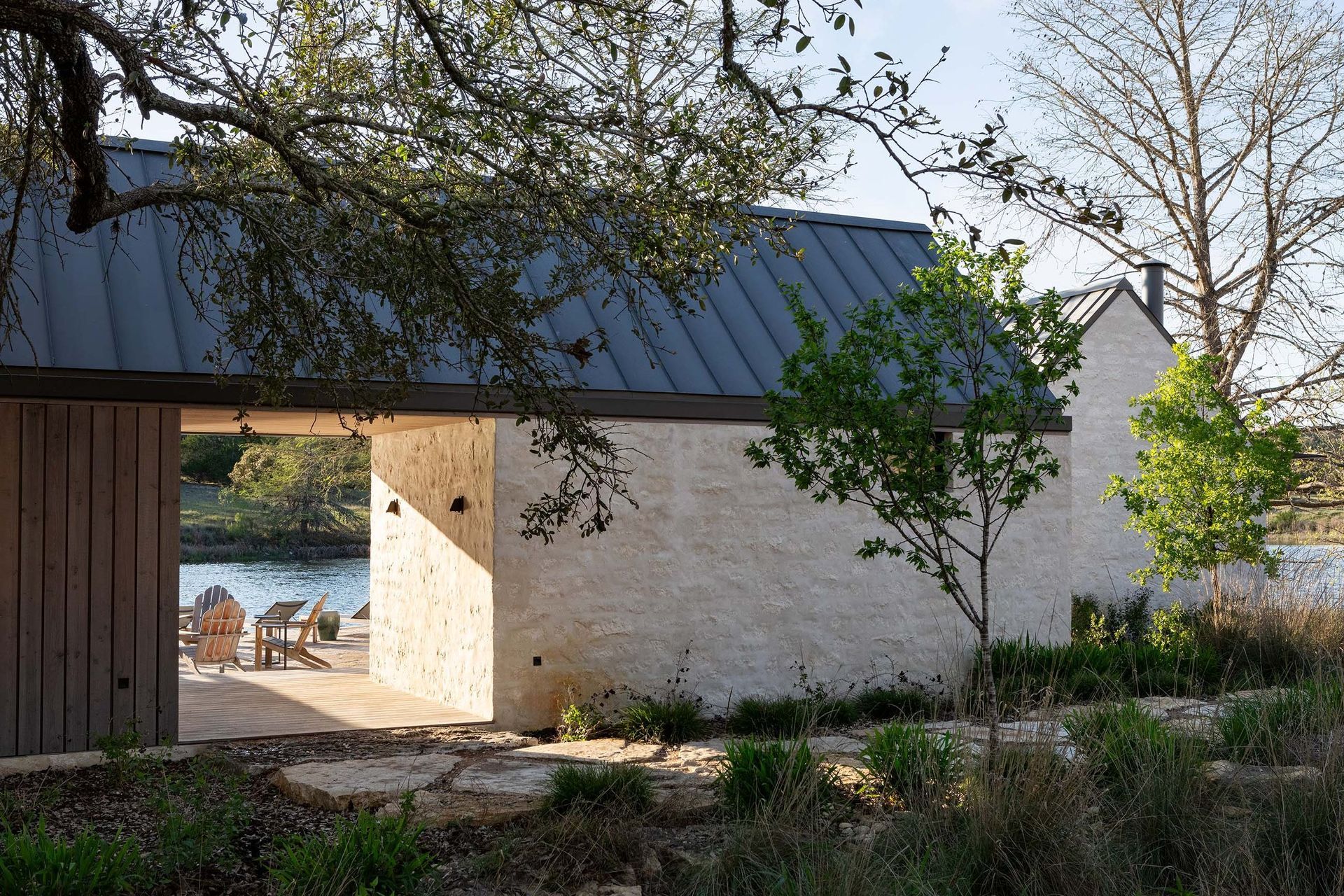 15RanchRecreationCuppettKilpatrickArchitectureandInteriorDesignaustin-tx-lake-pavilion-stone-buildings-native-landscape.jpg
