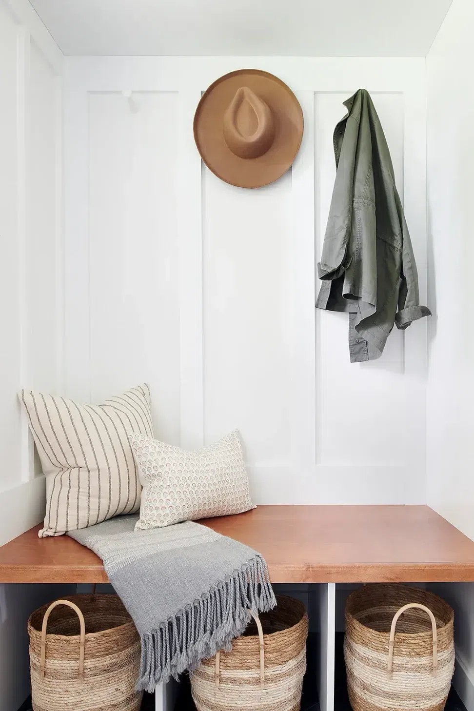 Sharp-and-Grey-Interiors-Rose-Valley-Philadelphia-mudroom-built-in-bench-with-hooks-and-baskets-cubbies.webp