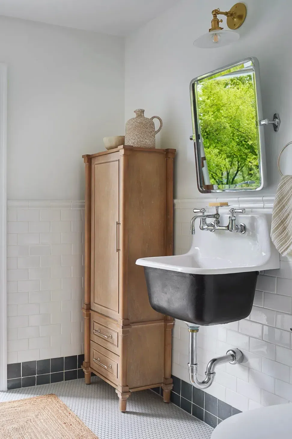 bathroom-renovation-farmhouse-style-sink-black-white-tile-sharp-and-grey-interiors-philadelphia-pa.webp
