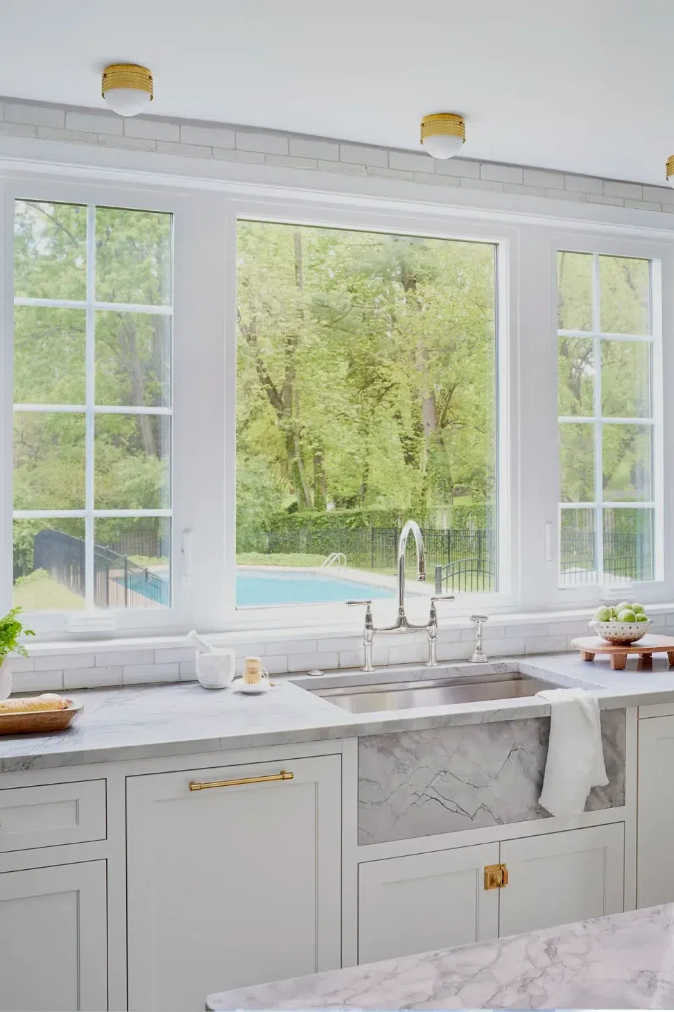 kitchen-renovation-white-wood-cabinets-white-subway-tile-backsplash-marble-counter-top-sharp-and-grey-interiors-philadelphia-pa.webp