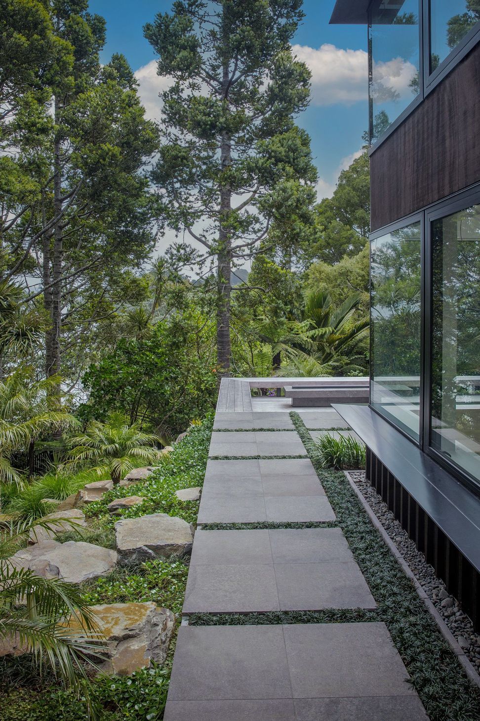 Stone paved side path, hardwood deck and fire pit.