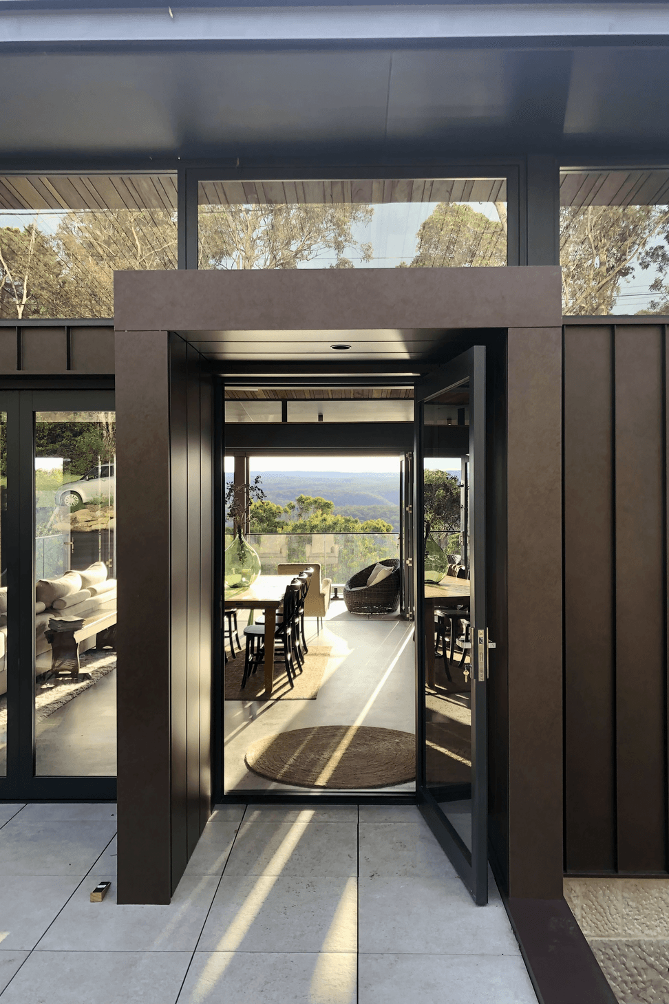 The corten entry portal transports you to a world of green and peace.