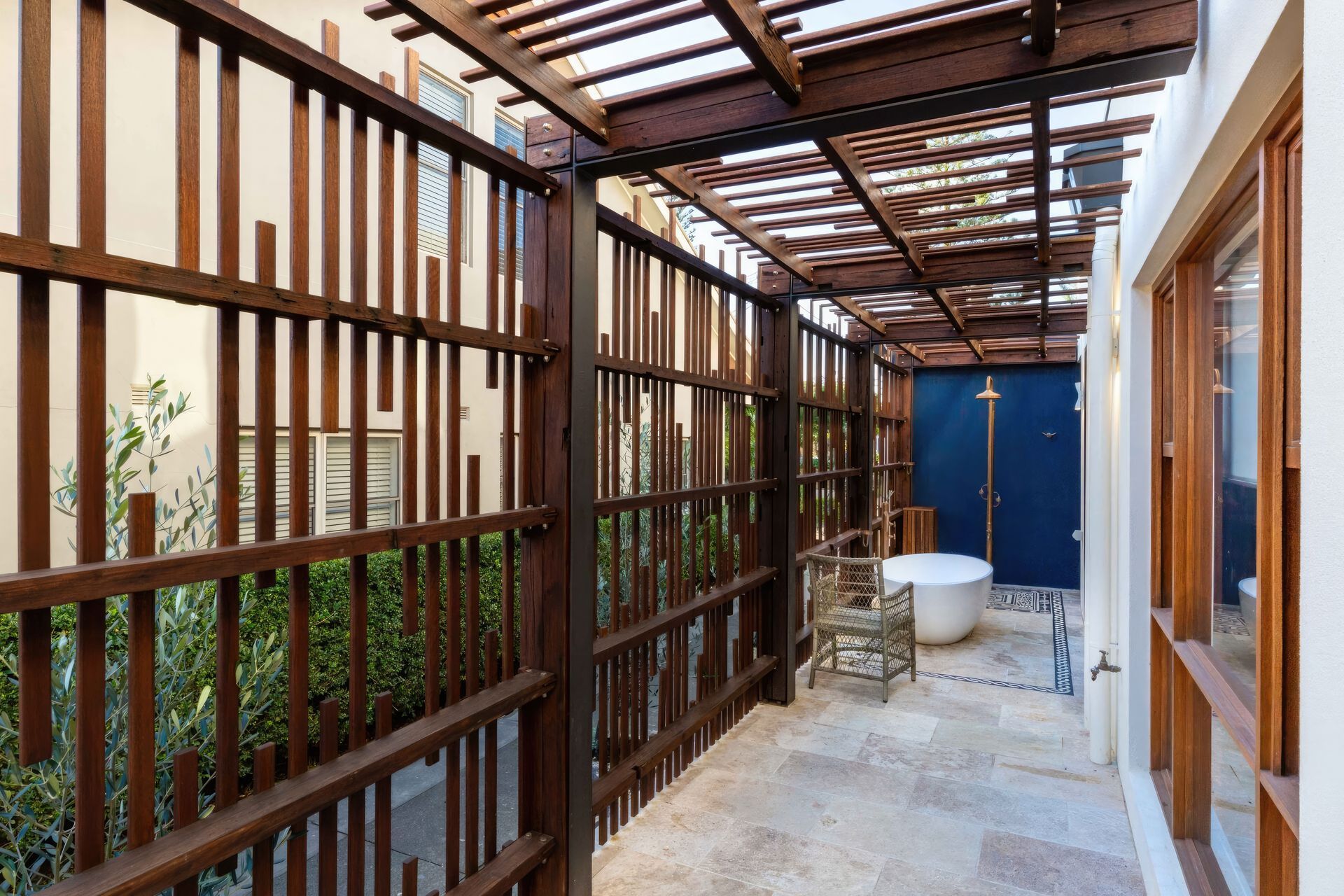 upBar-Beach-Urban-Oasis-Screened-outdoor-shower-area-and-bath-scaled-fix-standard-scale-200x.jpg