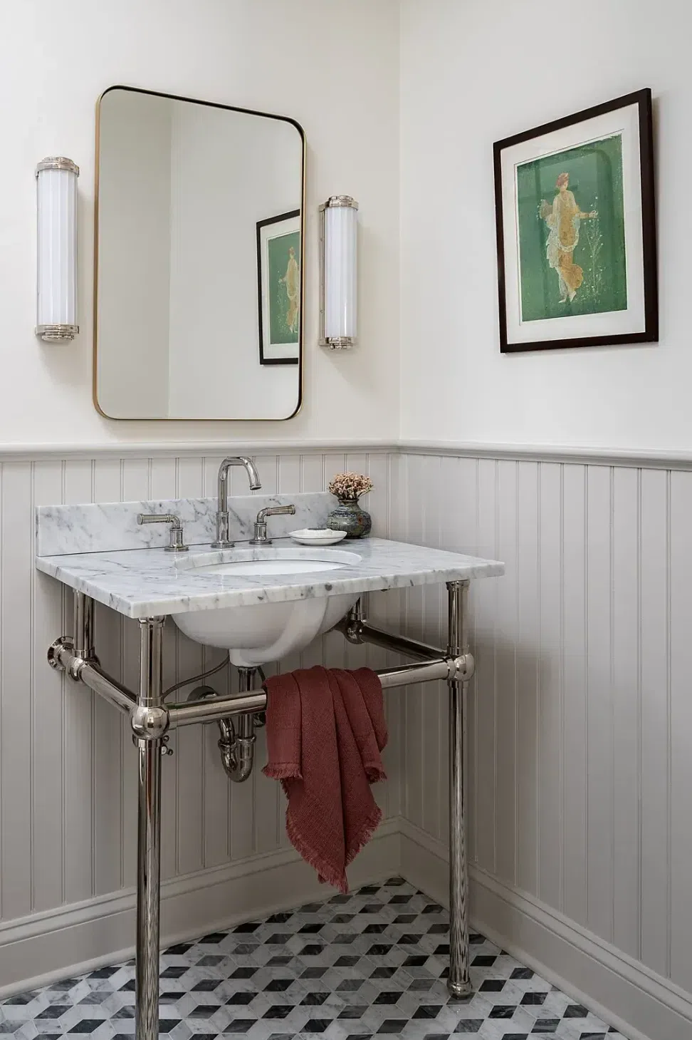 marble-console-sink-chrome-legs-marble-diamond-shape-tile-floor-light-grey-wainscoting.webp