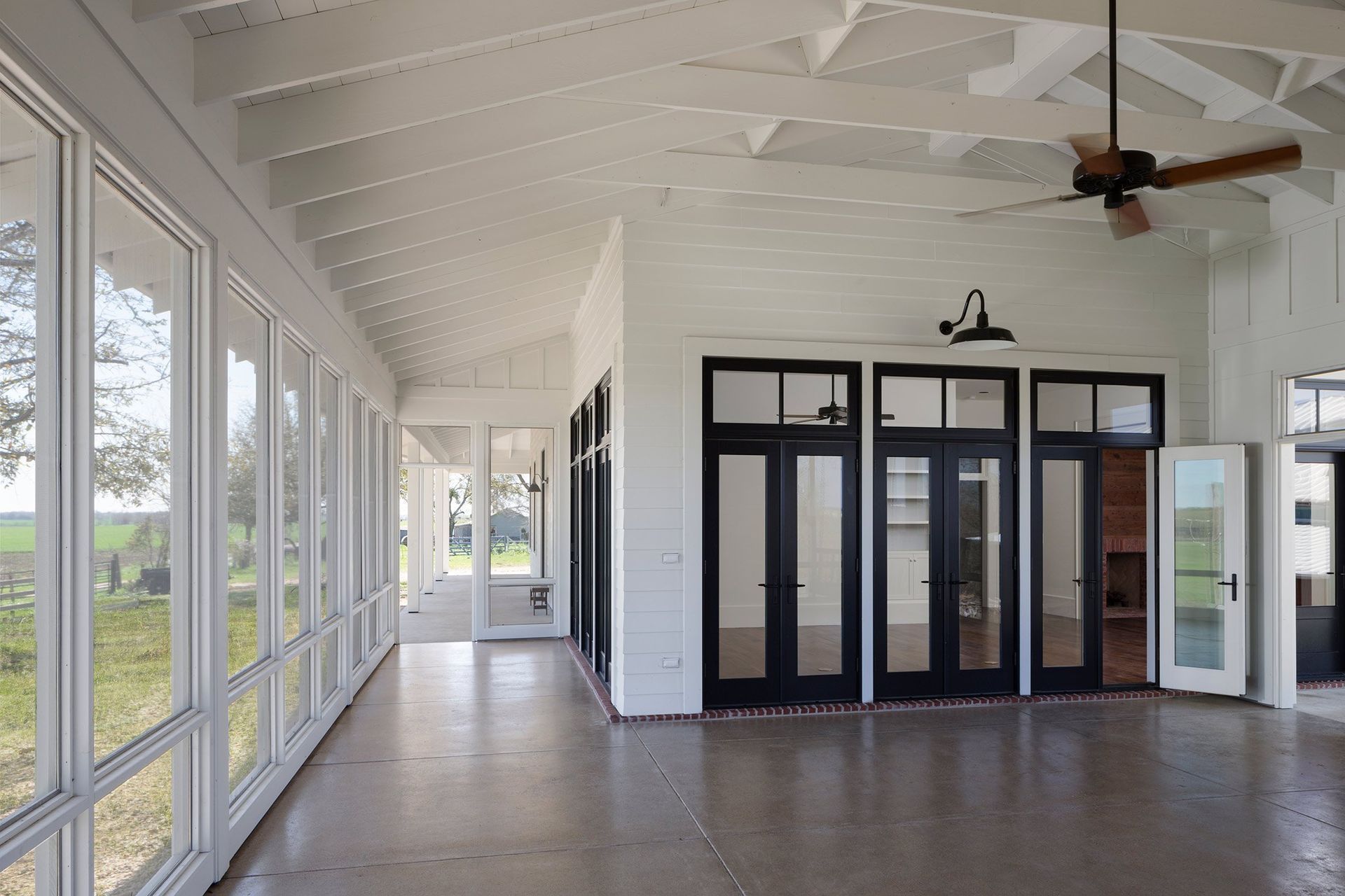 13PendletonFarmCuppettKilpatrickArchitectureandInteriorDesignaustin-tx-farmhouse-screened-porch-exposed-beams.jpg