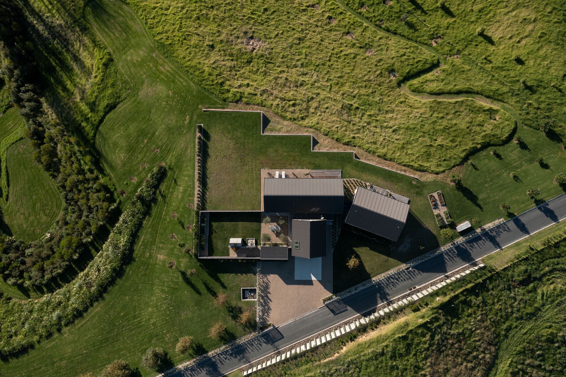 A bird's eye view of the three buildings; the bedroom wing on the right is offset from the living wing to ensure privacy.