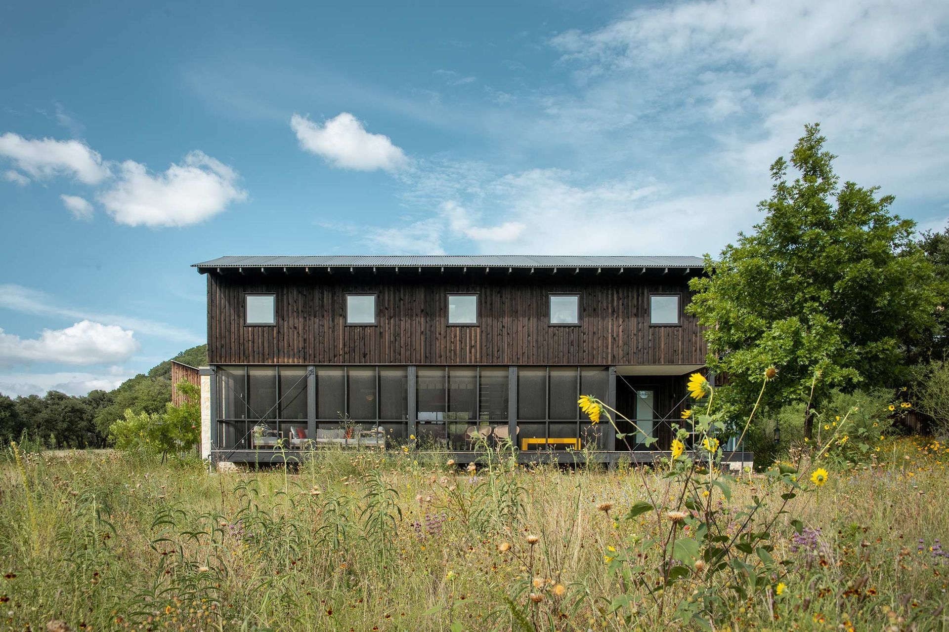 2CampFrioCuppettKilpatrickArchitectureandInteriorDesignmodern-wood-clad-cabin-screened-porch-nature.jpg