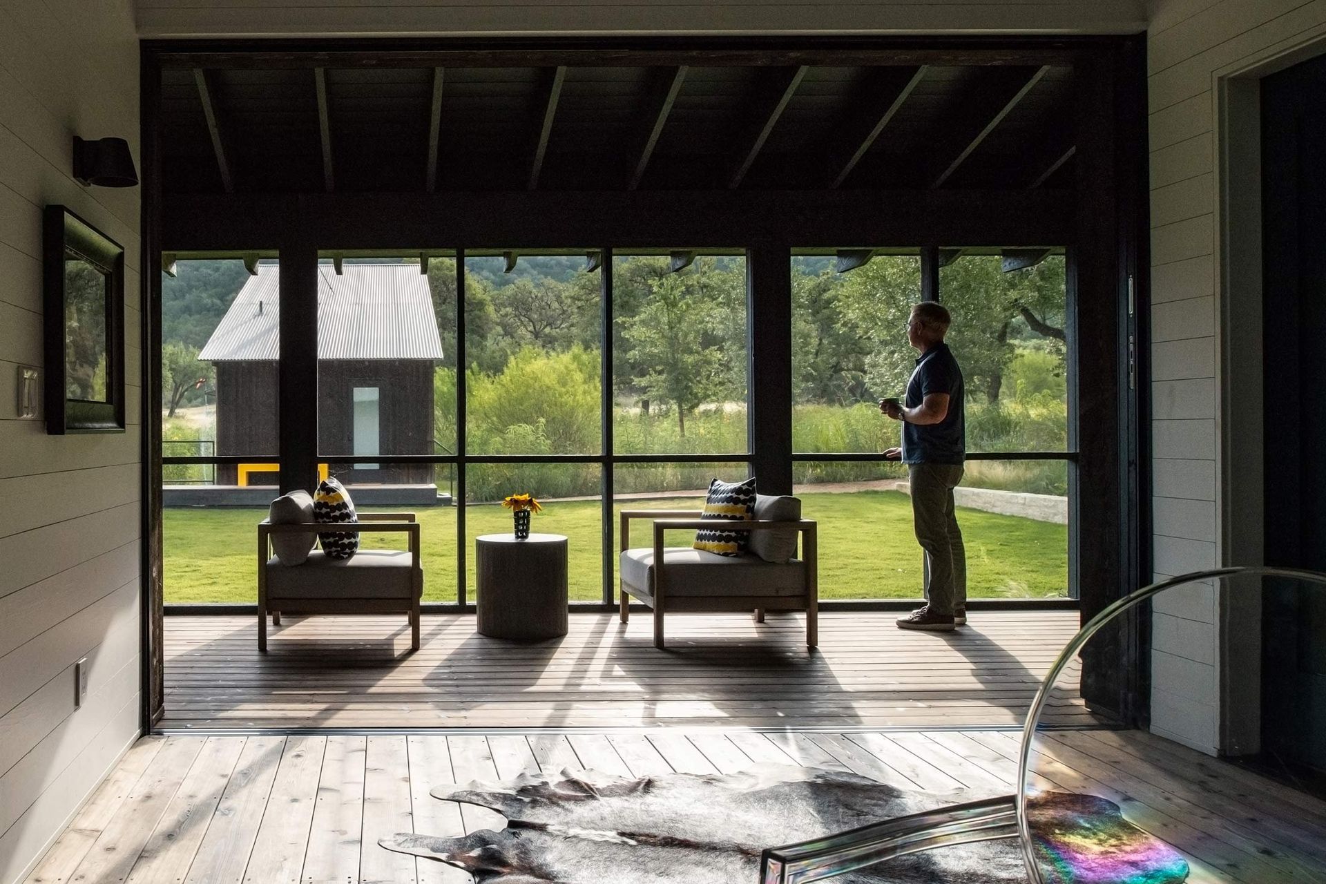8CampFrioCuppettKilpatrickArchitectureandInteriorDesignfunctional-porch-interior-wooden-beams-minimal-design.jpg
