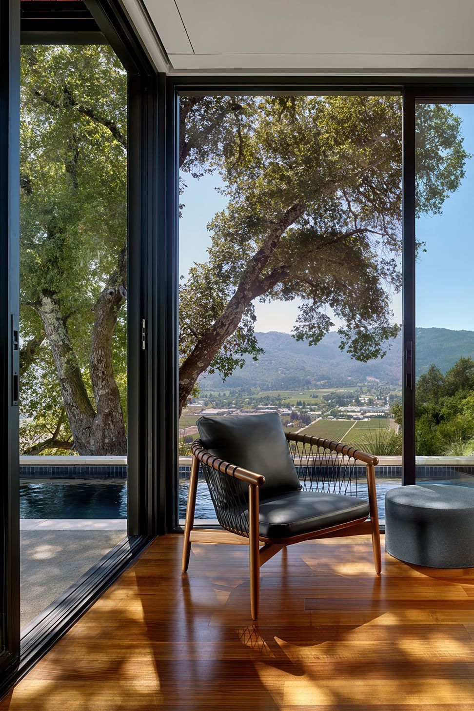 030Zack-de-VitoModern-Architecture-Construction-Design-BuildRidgeview-Estate-NapaCustom-HomeMaster-Bedroom-Corner-Chair-PoolCesar-Rubio.jpeg