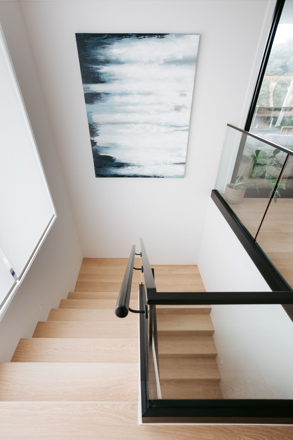 Downstairs includes a garage, separate laundry, main bathroom and two bedrooms.