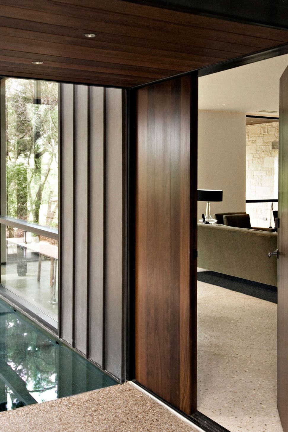 6HouseinTreesCuppettKilpatrickArchitectureandInteriorDesignaustin-tx-entrance-wood-door-pool-view.jpg