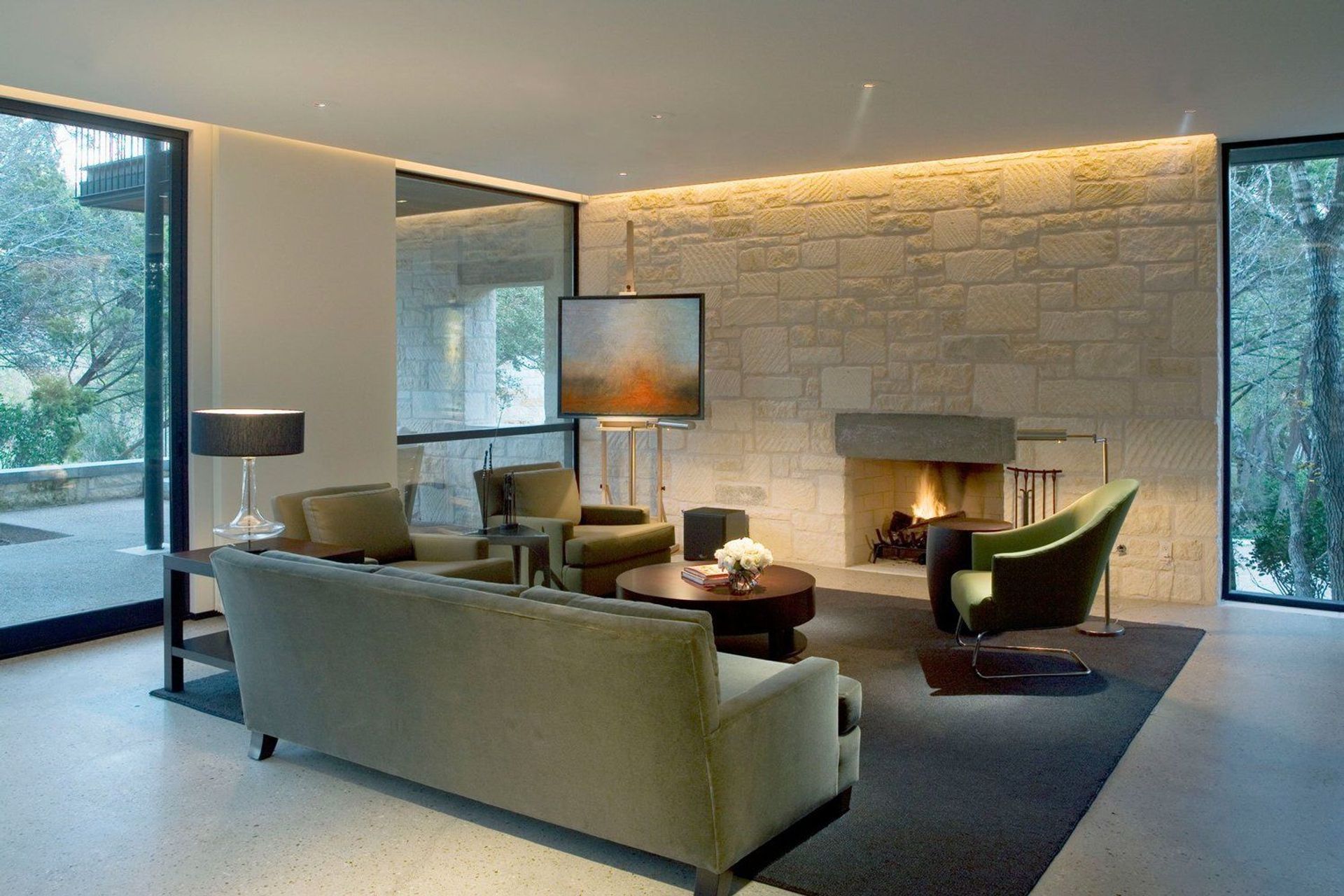 7HouseinTreesCuppettKilpatrickArchitectureandInteriorDesignaustin-tx-living-room-limestone-fireplace-cove-lighting.jpg