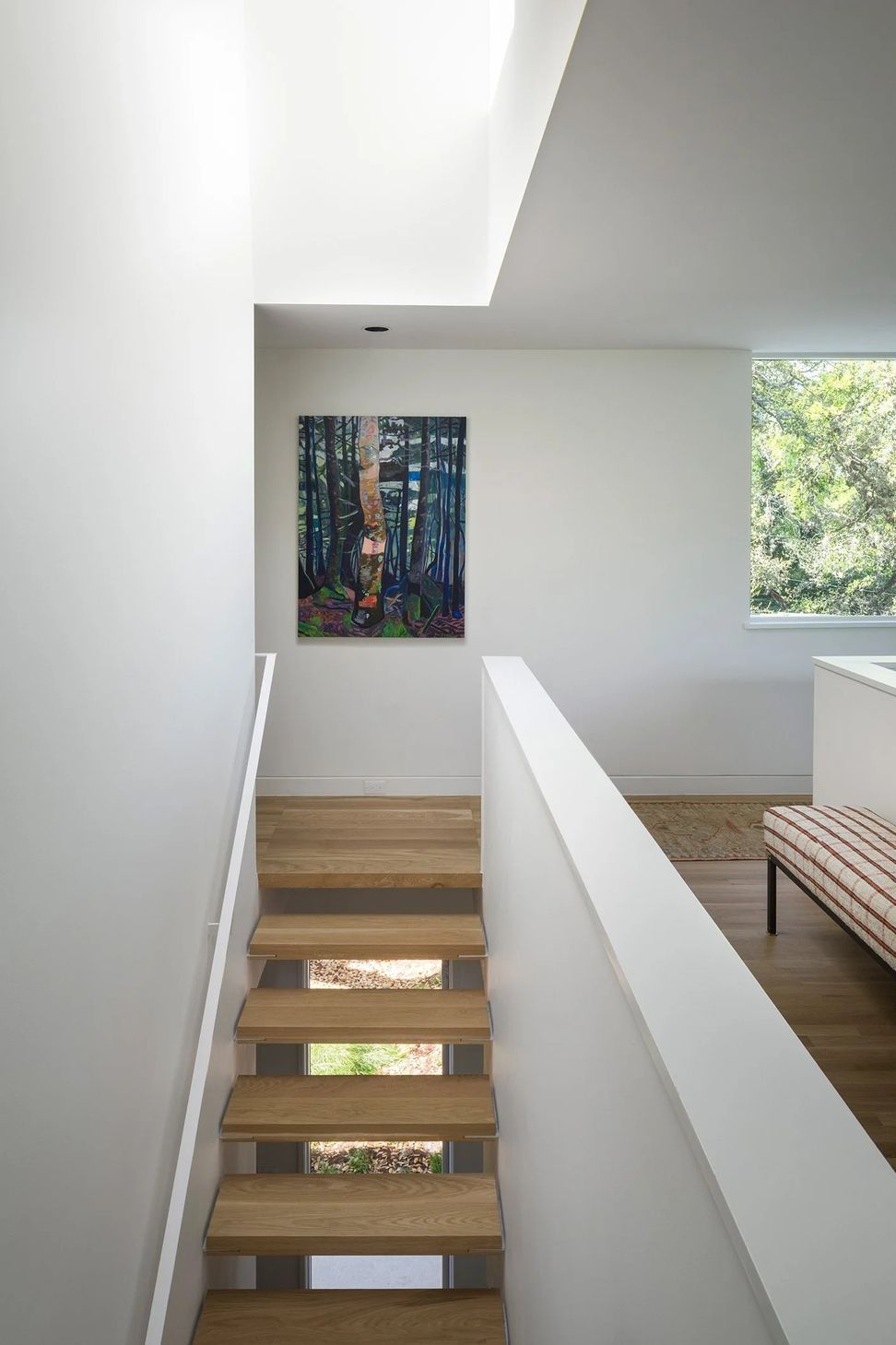 9HillsideCuppettKilpatrickArchitectureandInteriorDesignaustin-tx-open-riser-stair-skylight-artwork-ap-compressed.jpg