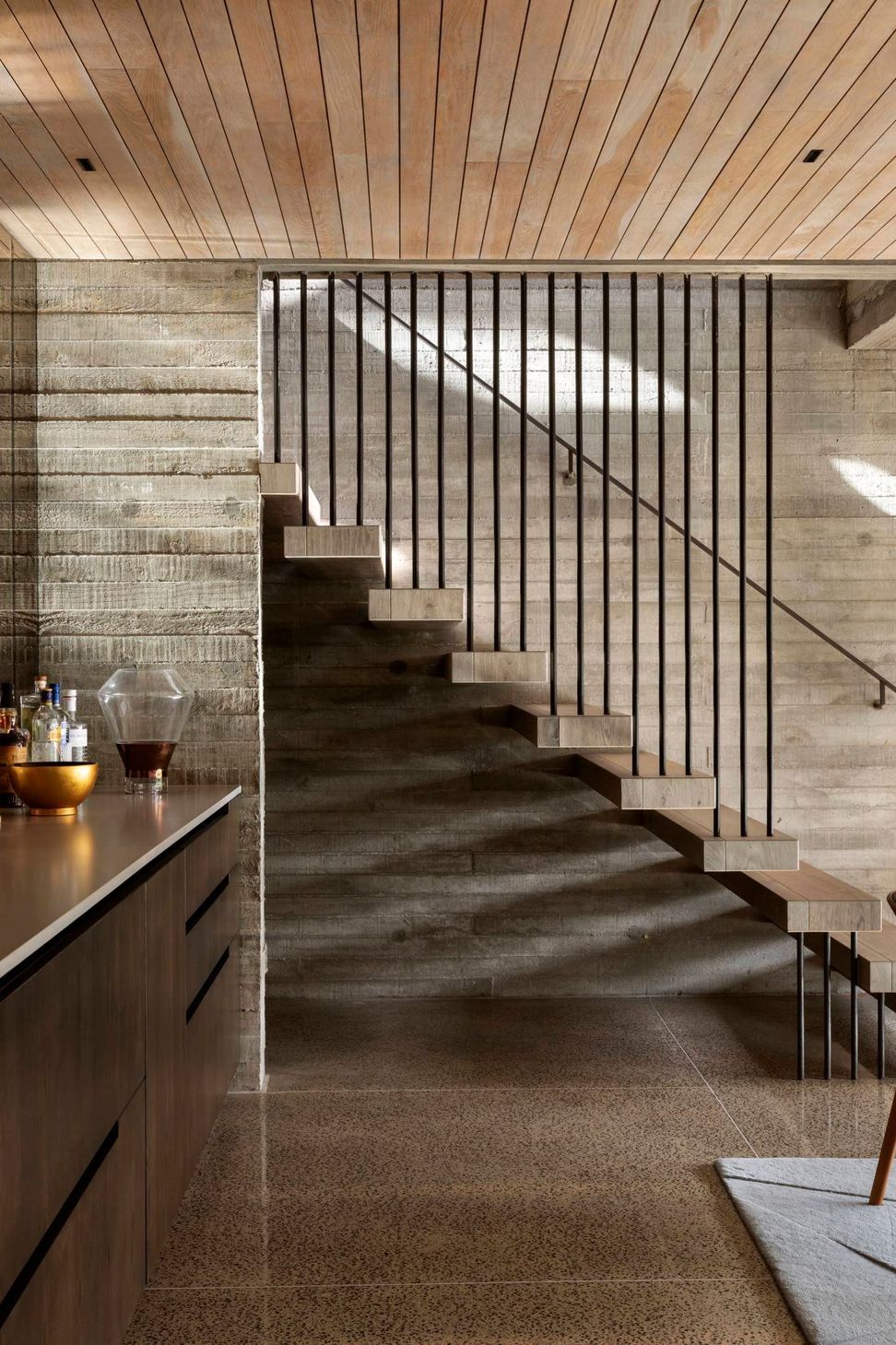 The architect's vision was to provide opportunities for natural light to be brought into the built environment. Open risers on the stairs permit light and create shifting shadows throughout the day.