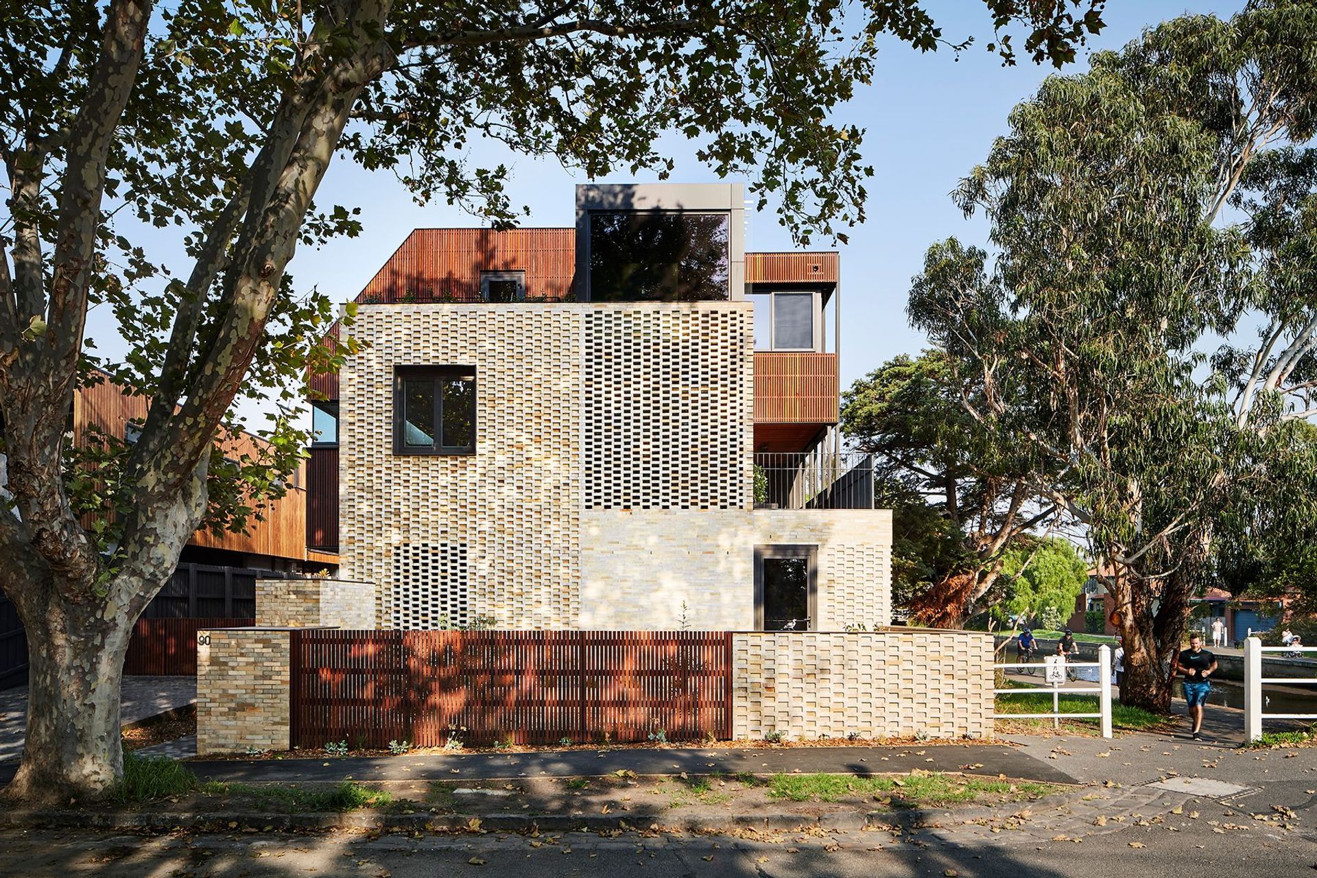 Dimpled brickwork creates a full breezeway on the east and west facades