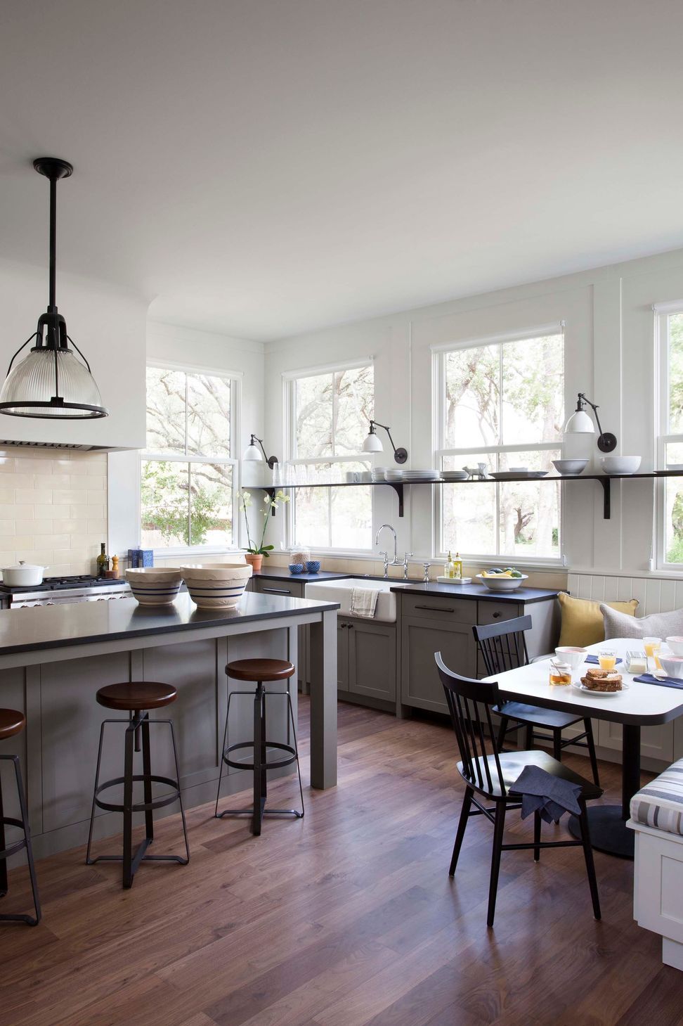 09BunnyRunCuppettKilpatrickArchitectureandInteriorDesignaustin-tx-kitchen-steel-shelf-window-sconces-breakfast-nook.jpg
