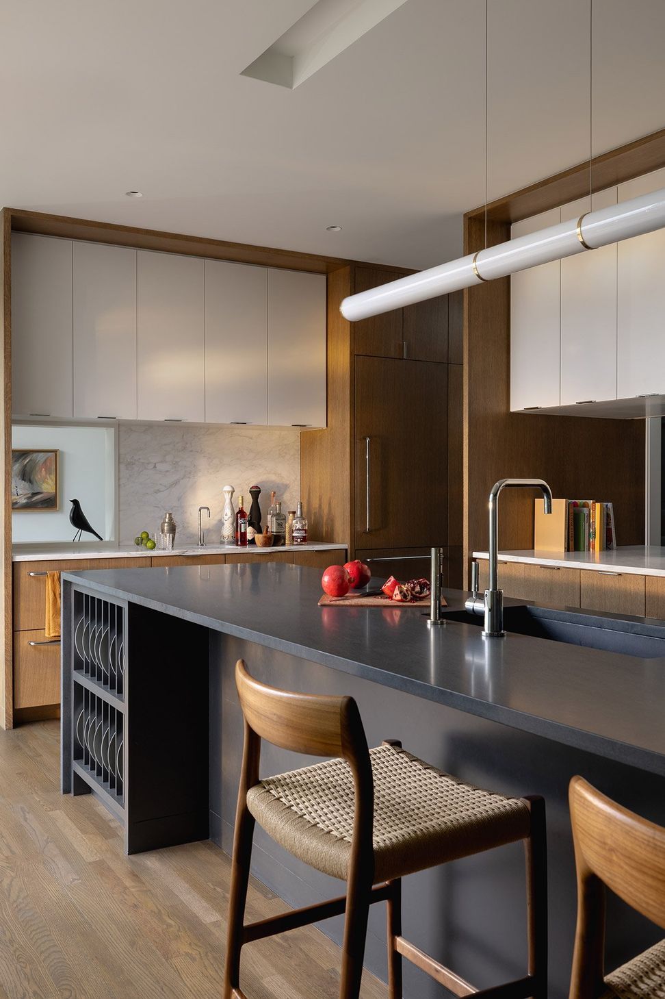 8RollingWoodCuppettKilpatrickArchitectureandInteriorDesignsophisticated-kitchen-design-dark-countertop-wood-cabinets-austin.jpg